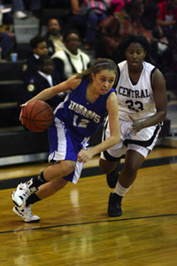 Bryant Lady Hornets point guard Taylor Hughes drives around Central's Shawnsee Arnold.