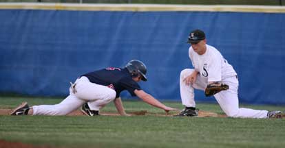 Brady Butler takes a pickoff throw to first as the Pine Bluff baserunner dives back to the bag. (Photo by Rick Nation)