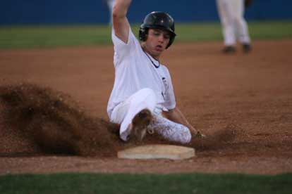 Tyler Sawyer slides into third to complete his first-inning RBI triple. (Photo by Rick Nation)