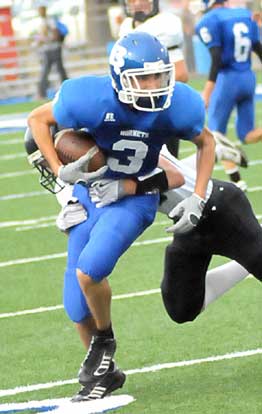 Devon Sears (3) tries to break a tackle after grabbing a pass. (Photo by Kevin Nagle)