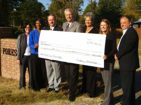 Pictured from left – Amanda Lee, Grant Analyst AEDC, Conya Spencer, Program Manager CAPDD, Richard Penn, Bryant Public Works Director, Mayor Larry Mitchell, LaVenia Jones, Bryant Planning Coordinator, Lindsey Jester, Grant Analyst AEDC, and Rodney Larsen, Director CAPDD.