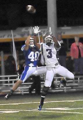 Bryant's Dylan Blasi (40) contends with Conway's Desmond Cox (3) for a long pass which Cox brought down. (Photo by Kevin Nagle)