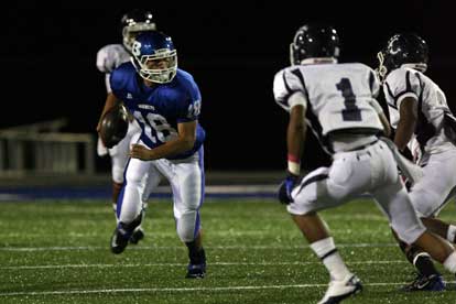 Bryant's Hunter Mayall (18) returns one of two interceptions the Hornets collected. (Photo by Rick Nation)