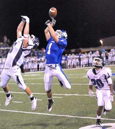 Sawyer Nichols (1) and Hunter Moix (6) leap for a pass that neither came down with. On the tip, Teshaun Sims (20) did. (PHoto by Kevin Nagle)