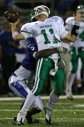 Van Buren quarterback Tyler Spoon absorbs a hit from Bryant's Dillon Winfrey on a corner blitz. (Photo by Rick Nation)