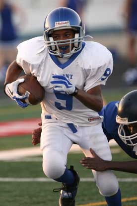 Jordan Murdock breaks a tackle on his way into the end zone. (Photo by Rick Nation)