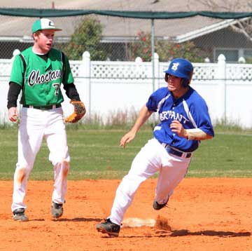 Brennan Bullock, right, rounds second. (Photo by Phil Pickett)