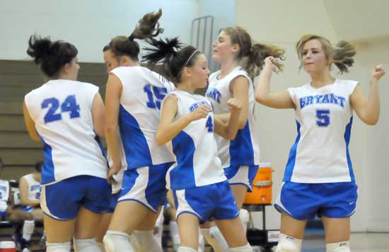 The Lady Hornets Junior Varsity players celebrate a point. (Photo by Kevin Nagle)
