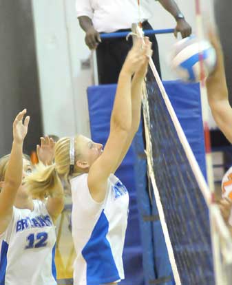 Maggie Hart goes up for a block. (Photo by Kevin Nagle)