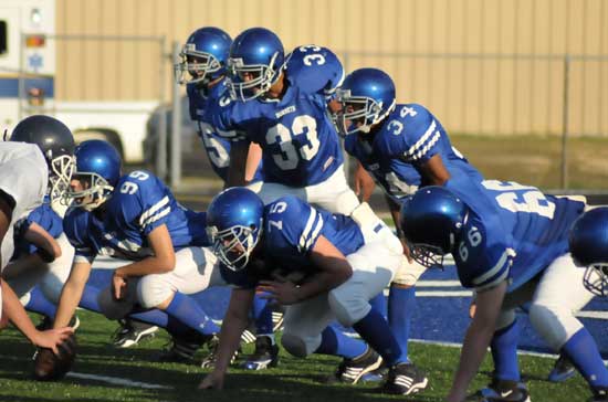 Bryant defenders Jason Hastings (25), Brendan Young (33), Brushawn Hunter (34), Tommy Wedge (99), Drew Allen (75) and Caleb McElyea (66) get set to try to make a goal line stand. (Photo by Kevin Nagle)