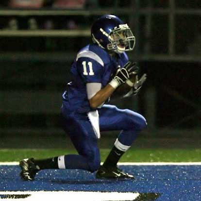 Bryant's Austin Miller (11) cradles a touchdown pass. (Photo by Rick Nation)