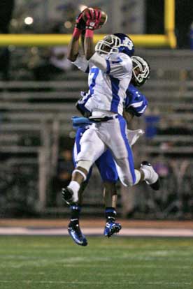 Aaron Bell (7) goes high for one of his two interceptions. (Photo by Rick Nation)