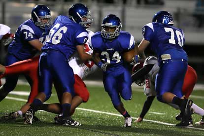 Bryant linemen Chad Adams (74), Caleb Chaffin (66) and Caleb McElyea (70) make way for Brushawn Hunter (34). (Photo by Rick Nation)