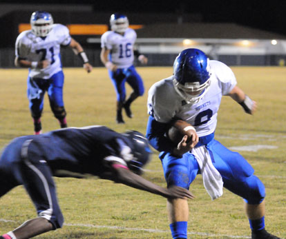 Wesley Akers (9) tries to break a tackle. (Photo by Kevin Nagle)