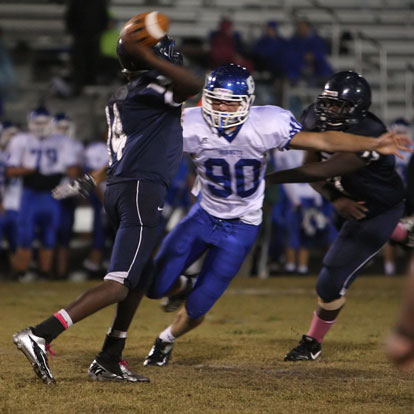 Bryant's Justin Hollingshead pressures Fair passer Issac Nelson (14). (Photo by Rick Nation)