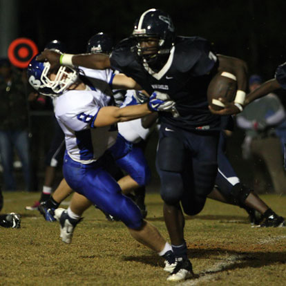 Bryant safety Davis Nossaman (8) makes a tackle on Fair's Elijah Shepherd despite the stiff-arm. (Photo by Rick Nation)