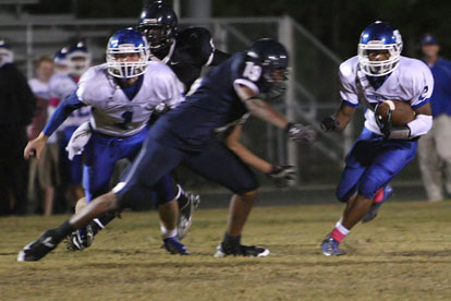 Brushawn Hunter (2) heads upfield as teammate Austin Powell (1) looks for a blocking opportunity. (Photo by Rick Nation)