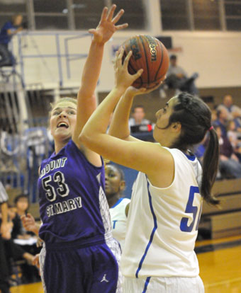 Bryant's Whitney Meyer sets to shoot over Mount St. Mary's Mallory Kleine. (Photo by Kevin Nagle)