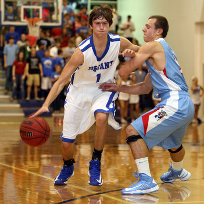 Bryant's Tyler Simmons drives past Southside's Andrew Hindman. (Photo by Rick Nation)