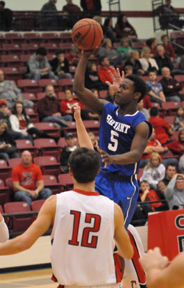 K.J. Hill puts up a shot after driving into the lane. (Photo by Kevin Nagle)