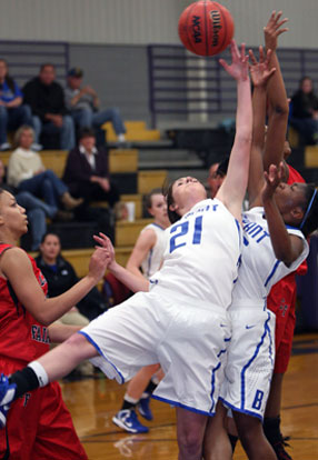 Courtney Davidson (21) and Dezerea Duckworth battle for a rebound during Thursday's game against Camden Fairview at CAC. (Photo by Rick Nation)