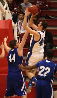 Zach Cambron (44) defends against Rogers' Nathan Musso. (Photo by Rick Nation)