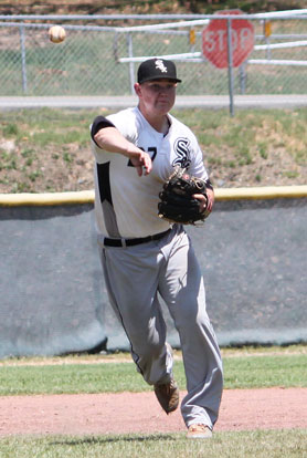 Third baseman Tyler Brown makes a throw to first. (Photo by Phil Pickett)