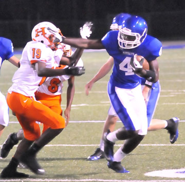 Greyson Giles (4) gets past Little Rock Hall defender Roddrick Collier (19). (Photo by Kevin Nagle)