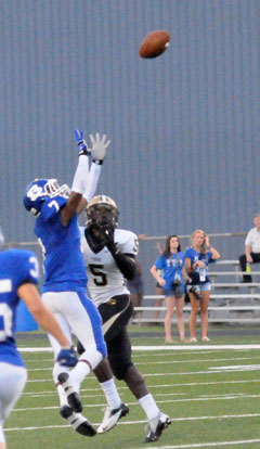 Bryant's Aaron Bell (7) goes high for an interception early in Friday's game. (Photo by Kevin Nagle)