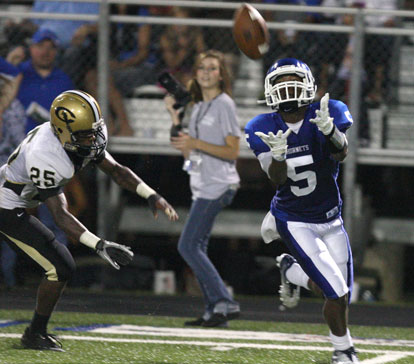 Bryant's K.J. Hill (5) runs under a pass ahead of Central's Bernell Yancy (25) on his way to his second touchdown reception. (Photo by Rick Nation)