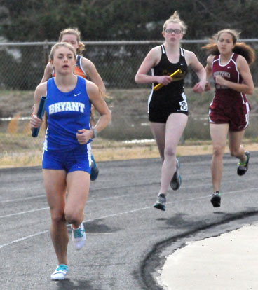 Talyn Billins turns the corner in the distance medley relay Thursday. (Photo by Kevin Nagle)