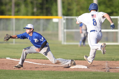 Ty Harris takes a throw to first in time to retire Sheridan's Ryan Taylor. (Photo by Rick Nation)