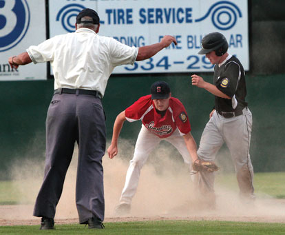 Trevor Ezell stands on the bag after a stolen base as Pine Bluff's Nick Hefley applies a late tag during Tuesday's first game. (Photo courtesy of Mike Adam)