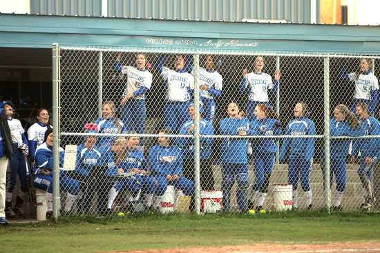 The Lady Hornets dugout cheers on their teammates. (Photo by Rick Nation)