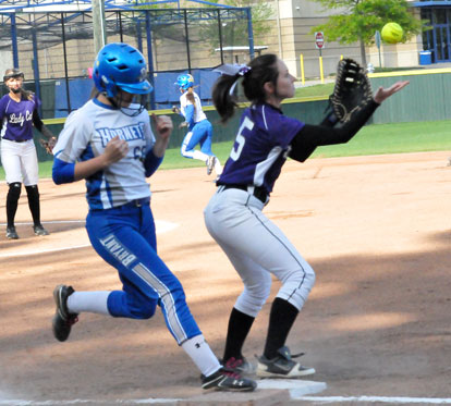 Breanna Sanders reaches first safely on a close play. (Photo by Kevin Nagle)