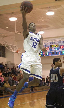 Cedarrian Crosby drives past Fair's Nick Jones. (Photo by Rick Nation)