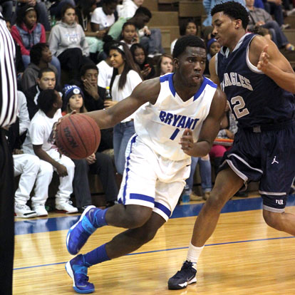 Greyson Giles (1) turns the corner near the baseline past J.A. Fair's Deshawn Gillkey-Gray. (Photo by Rick Nation)