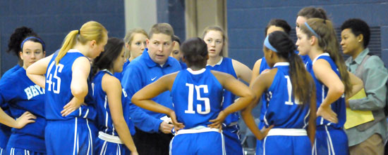 Coach Brad Matthews instructs his team during a timeout. (Photo by Kevin Nagle)