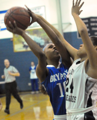 Jakeria Otey tries to get a shot away against J.A. Fair's Dabrielle Slater. (Photo by Kevin Nagle)