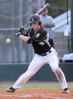 Trevor Ezell watches a pitch go by. (Photo by Kevin Nagle)