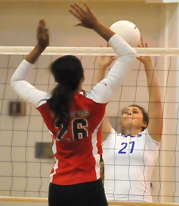 Bryant's Alex Dillard (27) battles at the net. (Photo by Kevin Nagle)