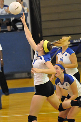 Kendall Selig tips a ball over the net. (Photo by Kevin Nagle)