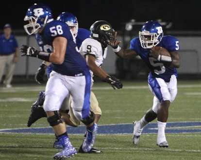 Cole Chapman (58) leads DeAmonte Terry (5) downfield as Central's Winston Heard (9) tries to make the play. (Photo by Rick Nation)