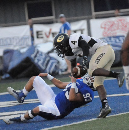 Madre Dixon (93) hauls down Central quarterback Jordan McCarther for a safety early in Friday's game. (Photo by Kevin Nagle)