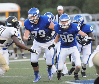 Cole Frischen (79), Janet Jacobs (86) and DeMaja Price (42) lead the blocking. (Photo by Kevin Nagle)