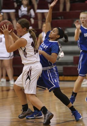 Emily Ridgell puts pressure on Benton's Taylor Oglesby, left. (Photo by Rick Nation)