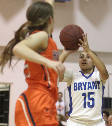 Emily Ridgell (15) fires a jumper over Rogers Heritage defender Shelby Thompson. (Photo by Rick Nation)