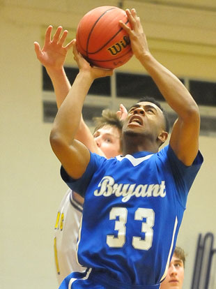 Romen Martin gets inside of a Catholic defender for a bucket. (Photo by Kevin Nagle)