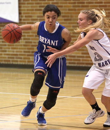 Raija Todd looks to drive around Mount defender Conley Norris (23). (Photos by Rick Nation)