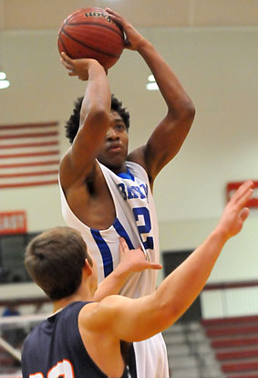 Braylon Steen lifts up above a Rogers Heritage defender for a jumper. (Photo by Kevin Nagle)